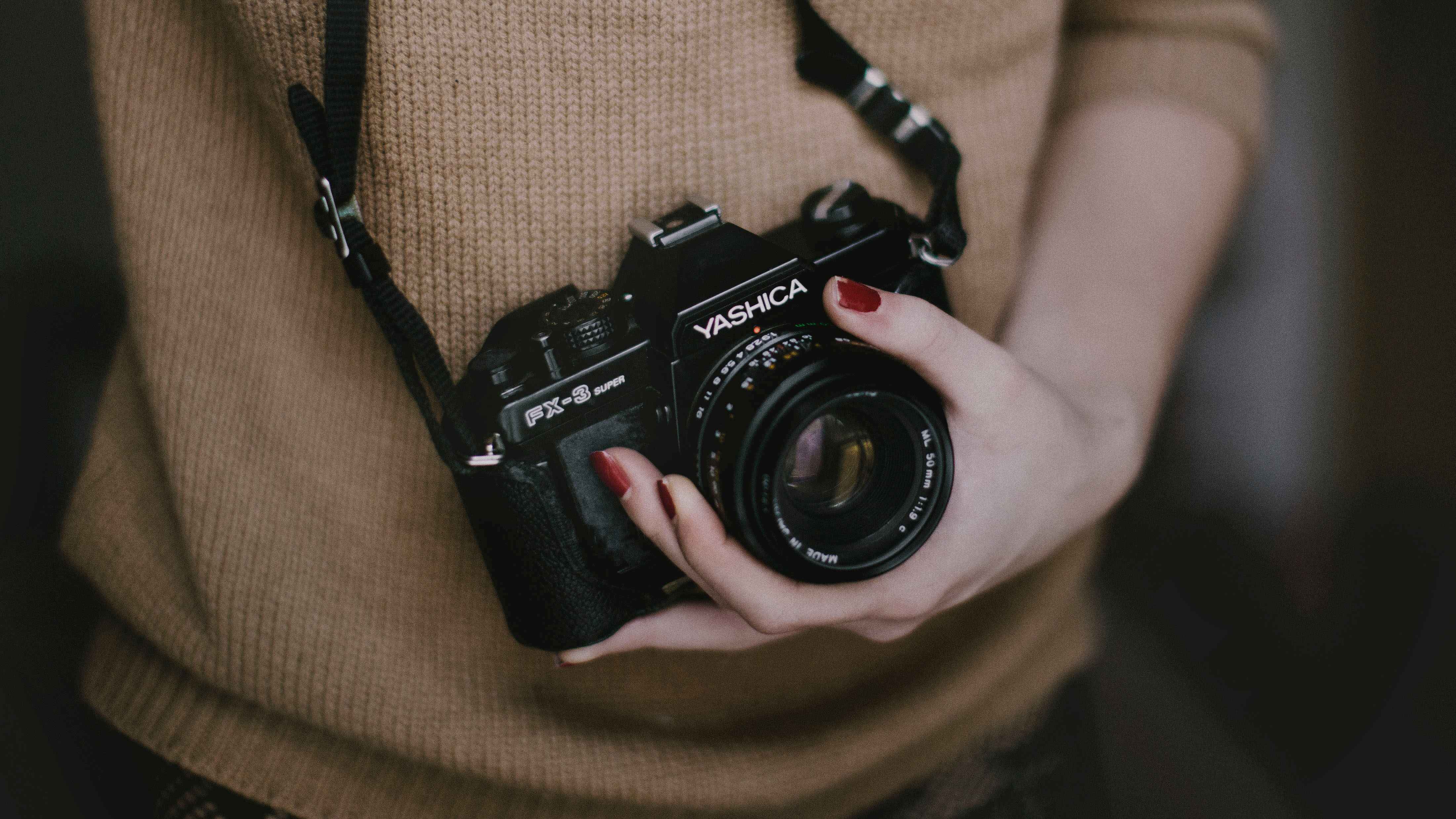 Person holding vintage camera